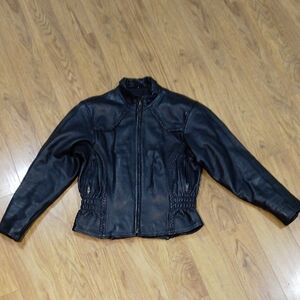 Vintage 1980s Leather Mill black motorcycle jacket with pockets